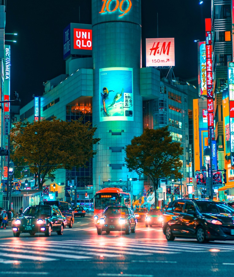 People gathered outside buildings and vehicles in Shibuya, Japan